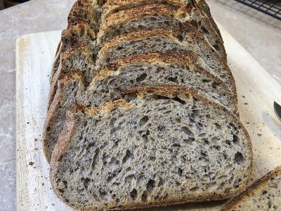 Ancient Grain Sourdough with (mostly) Black Sesame Seeds Crumb Shot
This is the crumb (internal structure) shot of the mixed grain bread with home-milled Red Fife wheat, Einkorn, Rye, and Central Milling Morebread bread flour.  It was very aromatic, with an excellent flavor to go along with the creamy, almost custardy texture.  Good eating!
