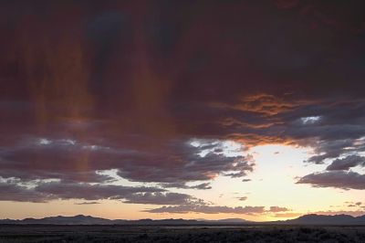 Dry Lake Sunset Shower
A brief rain shower blew in as we were photographing the incredible sunset colors at the nearby dry lake bed.  The sun had just gone down, and the light was changing really rapidly.  This shot is not all that good, but it is the best of many, so I kept it.
